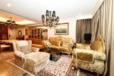 Luxurious living room with elegant furniture and chandelier lighting