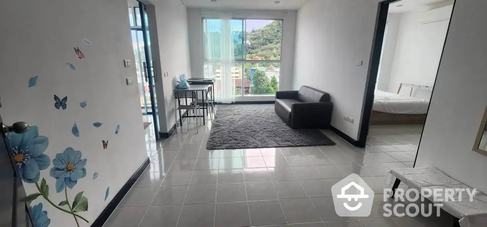 Spacious living area with modern decor and scenic view in a stylish apartment