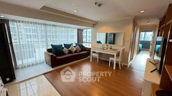Spacious living room with elegant decor and large windows in modern apartment