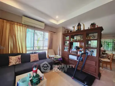 Spacious living room with modern decor and large window for natural light