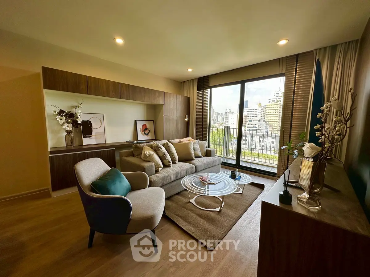 Modern living room with stylish decor and city view balcony, perfect for urban living.