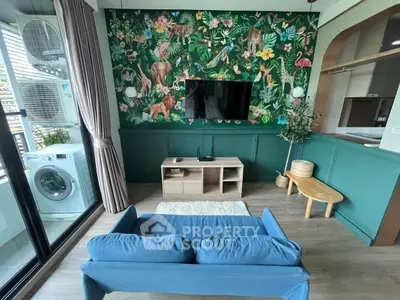 Stylish living room with vibrant jungle-themed wallpaper and modern furniture