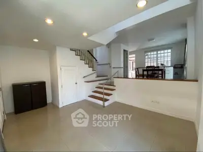 Spacious modern interior with open layout and elegant staircase