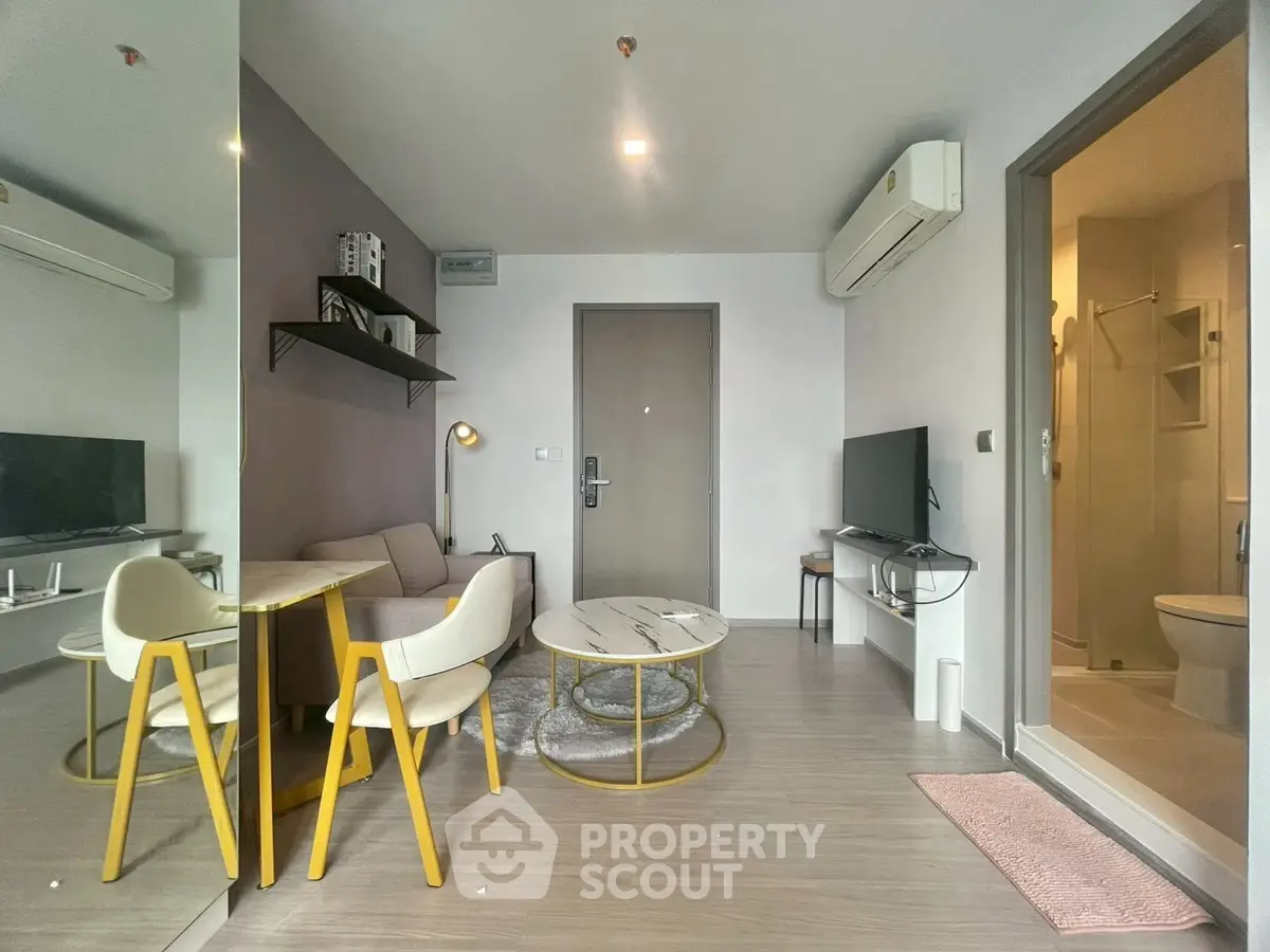 Modern living room with stylish furniture and air conditioning in a cozy apartment.