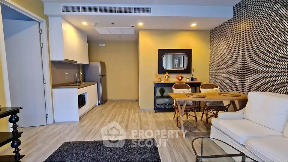 Modern living room with open kitchen and stylish decor