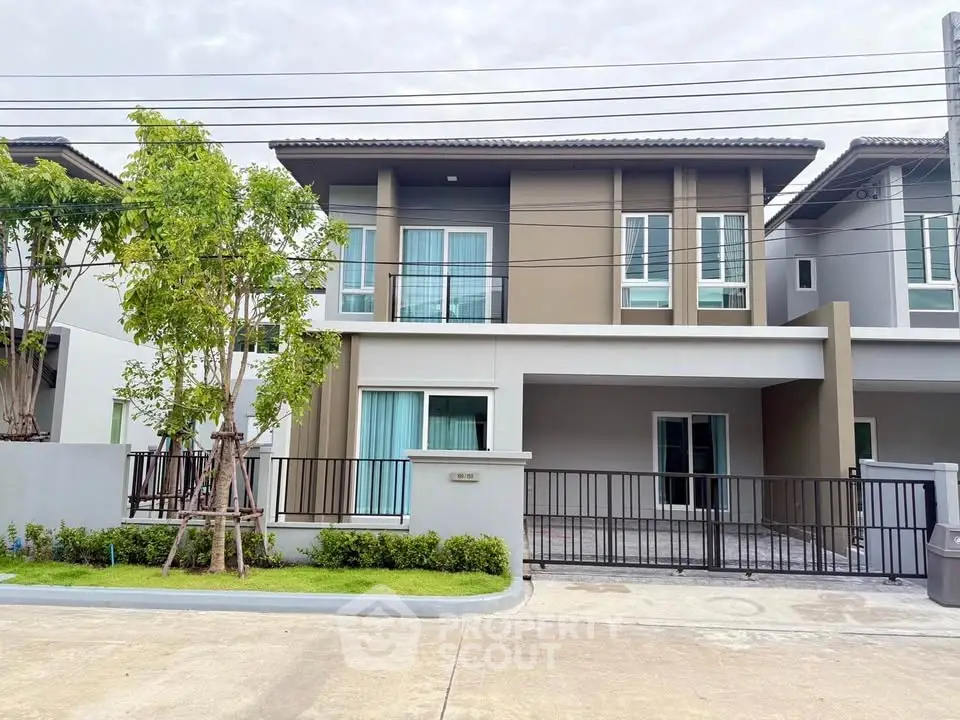 Modern two-story house with sleek design and spacious driveway
