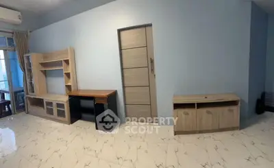 Spacious living room with modern furniture and marble flooring