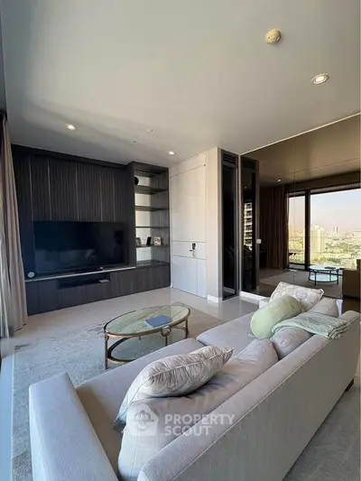 Modern living room with sleek design and city view, featuring a cozy sofa and entertainment center.
