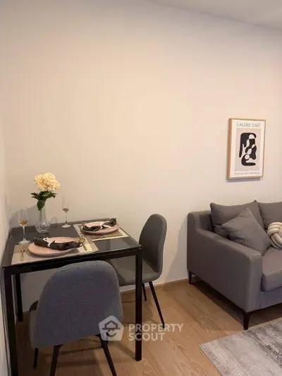 Cozy living room with modern decor and dining area, perfect for urban living.