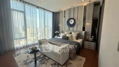 Luxurious bedroom with panoramic city view and elegant decor