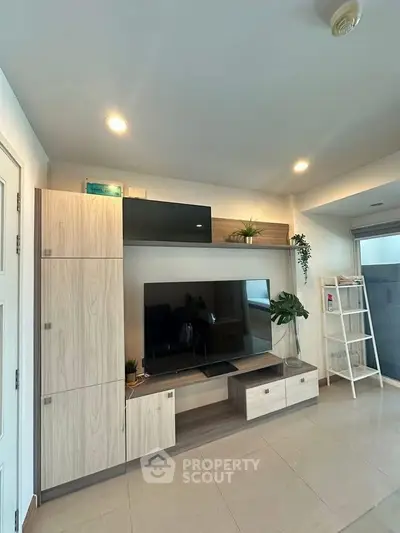 Modern living room with sleek TV unit and stylish decor