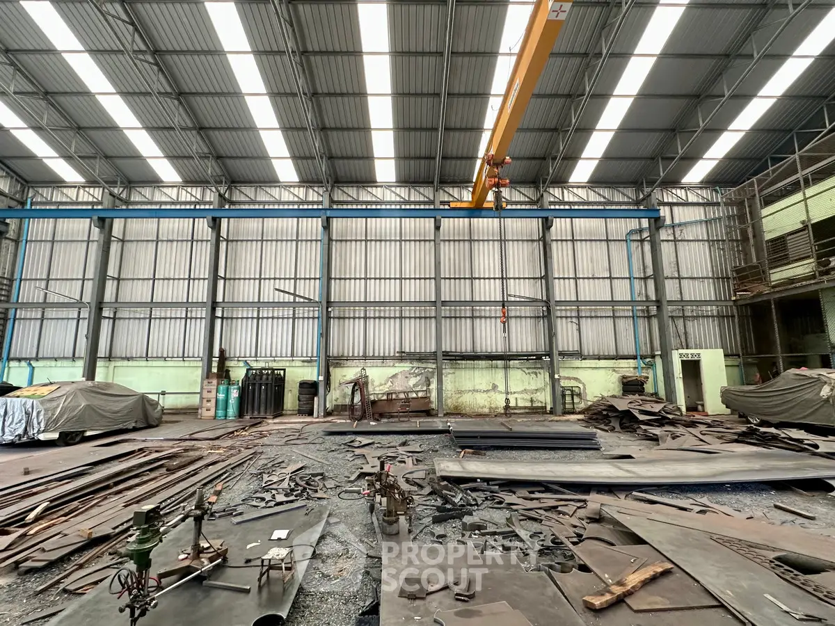 Spacious industrial warehouse with high ceilings and ample storage space.