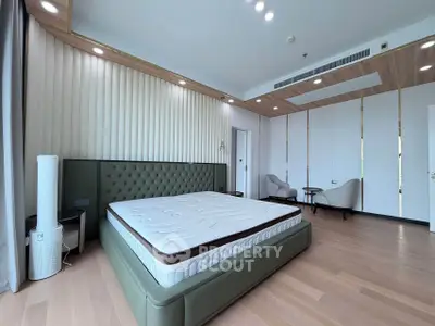 Spacious modern bedroom with elegant design and natural light