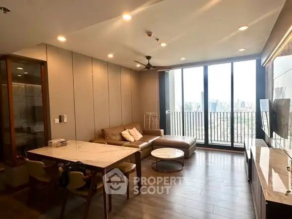 Modern living room with city view and stylish furniture