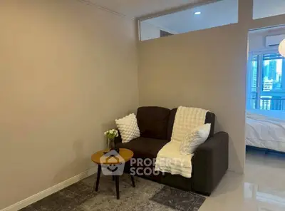 Cozy living room with modern sofa and city view in background