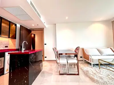 Modern open-plan living room with sleek kitchen and dining area