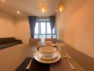 Modern dining area with elegant table setting and city view