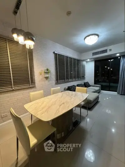 Modern living room with elegant dining area and large windows