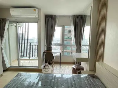 Modern bedroom with balcony and city view in high-rise apartment