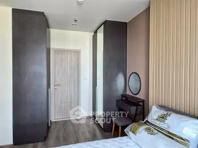 Modern bedroom with stylish decor and ample storage space