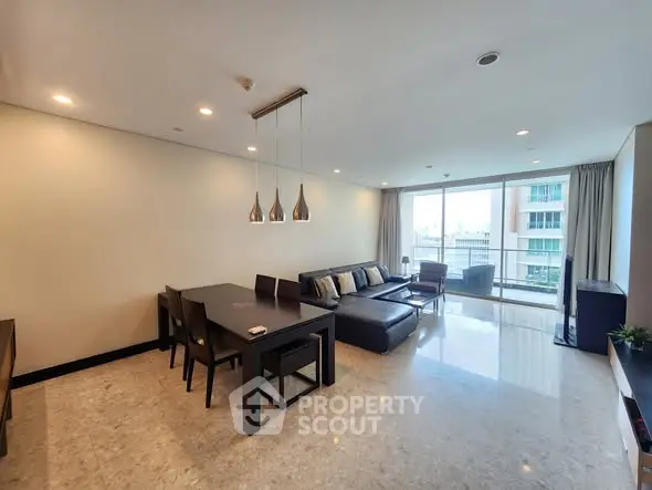 Spacious modern living room with elegant dining area and large windows.