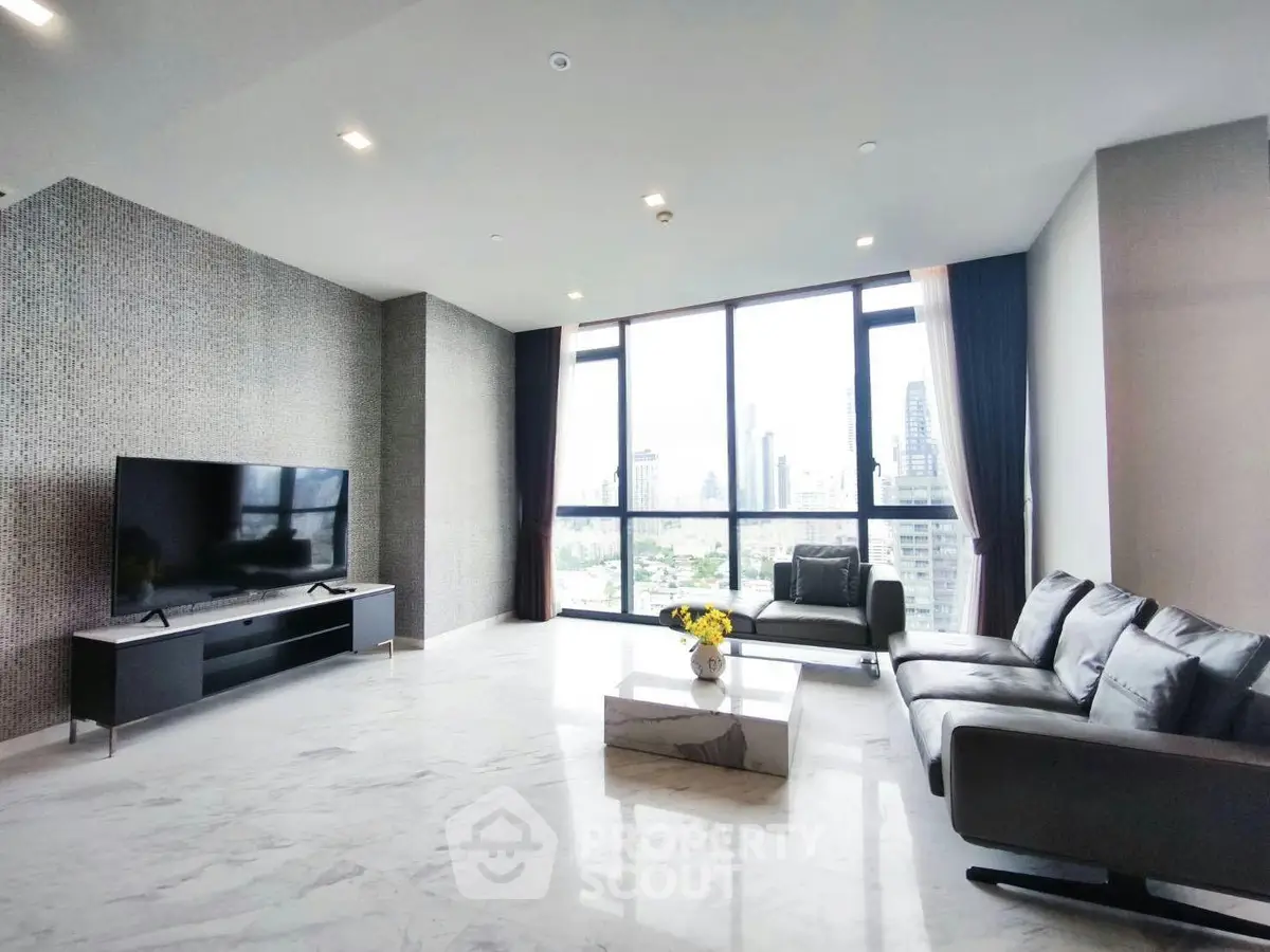 Spacious modern living room with large windows and city view, featuring sleek furniture and elegant decor.