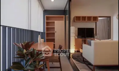 Modern living room with sleek furniture and natural light, featuring a cozy seating area and stylish decor.