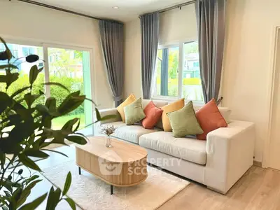 Bright and cozy living room with modern decor and garden view