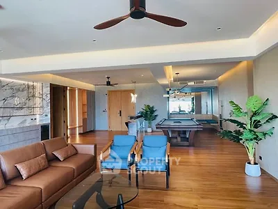 Spacious modern living room with pool table and elegant decor
