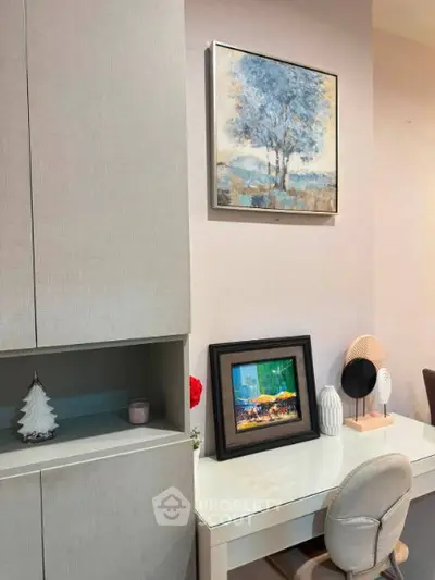 Chic study nook with modern decor and stylish artwork in a cozy home setting.