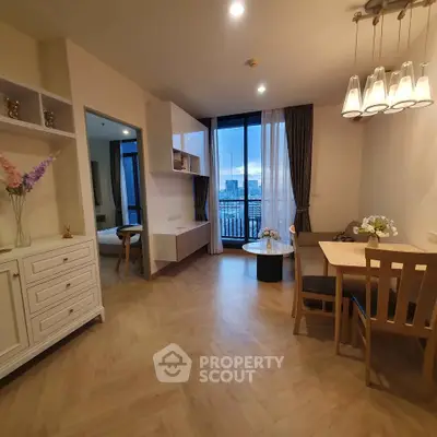 Modern living room with dining area and city view balcony
