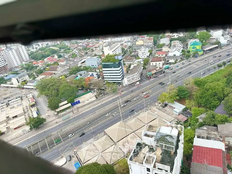 Stunning aerial view of urban landscape with roads and buildings, ideal for real estate insights.