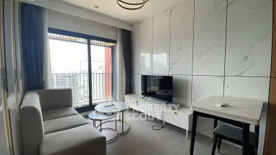 Modern living room with marble wall panels and city view balcony
