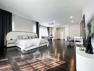 Luxurious and spacious bedroom with modern decor and elegant furnishings.