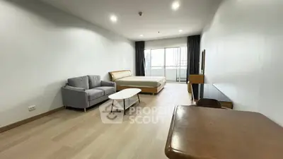 Spacious modern studio apartment with balcony and stylish furnishings