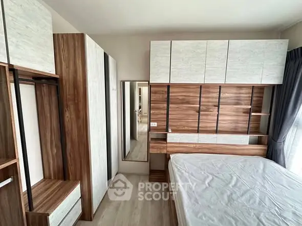 Modern bedroom with stylish wooden furniture and ample storage space