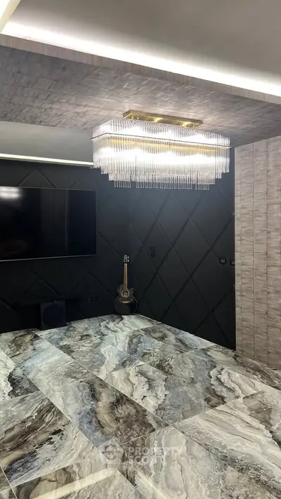 Luxurious modern living room with elegant chandelier and marble flooring
