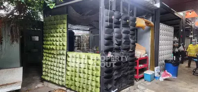 Unique outdoor storage area with modern design and innovative vertical planters.