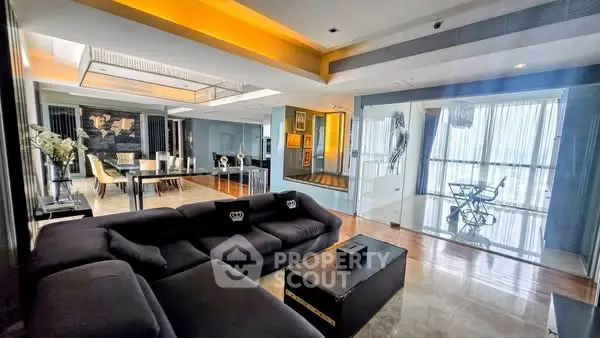 Luxurious modern living room with spacious open layout and elegant dining area.