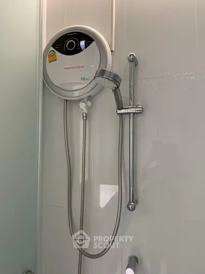 Modern bathroom with sleek shower unit and water heater