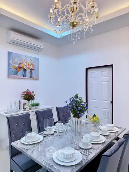 Elegant dining room with chandelier and modern decor