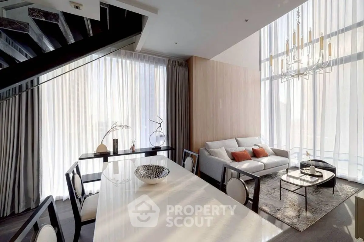 Luxurious modern living room with high ceilings and elegant decor