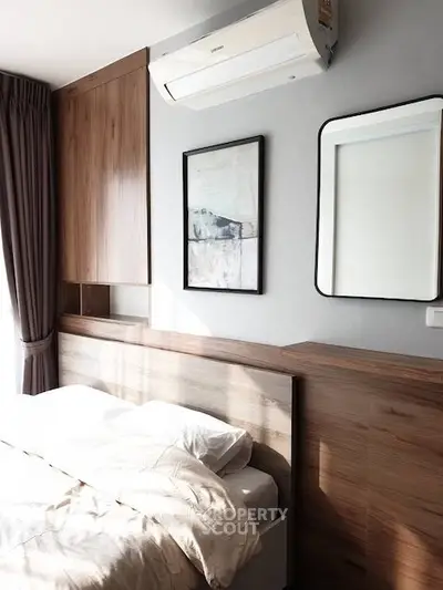 Modern bedroom with wooden accents and natural light