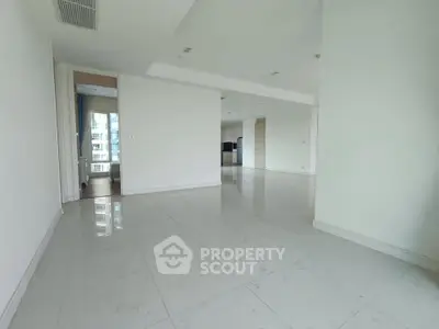 Spacious modern apartment with glossy tiled floors and open layout, perfect for customization.
