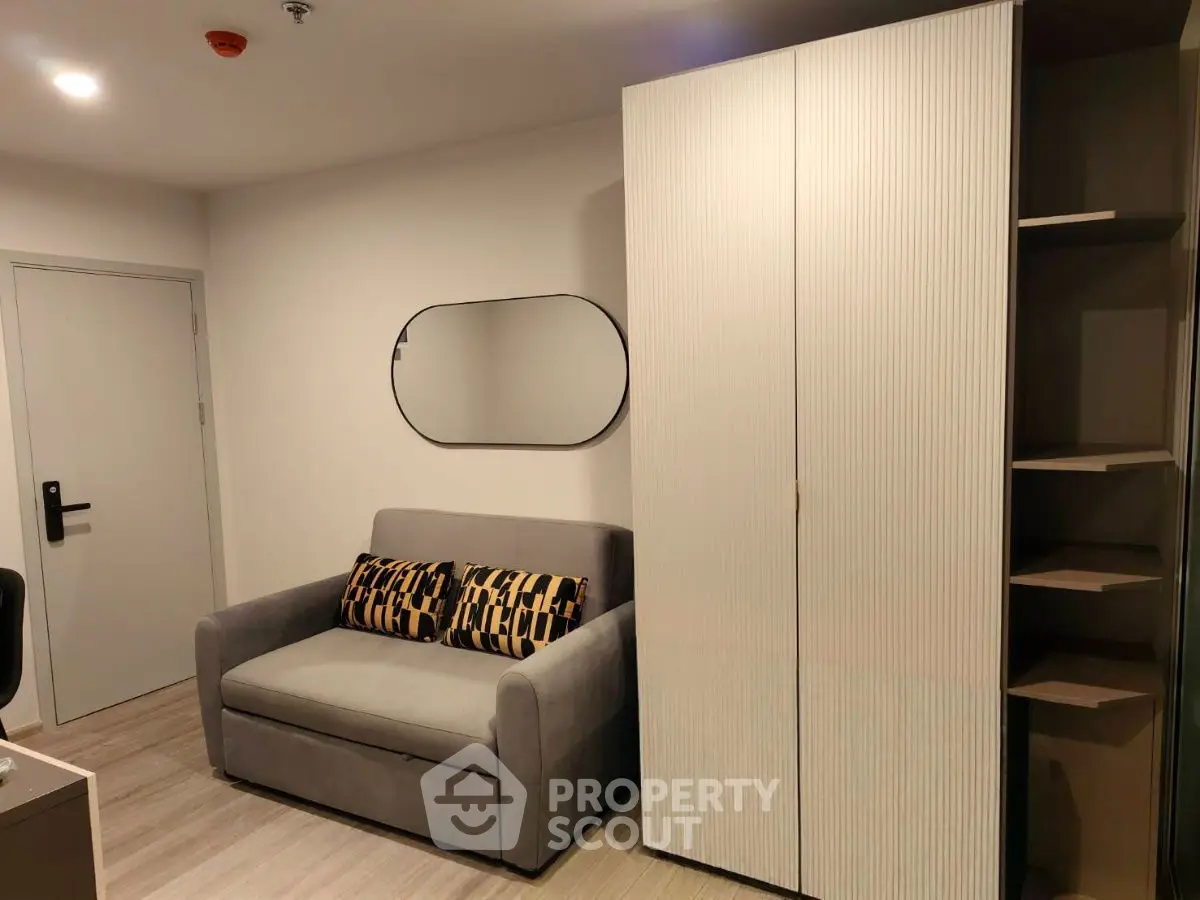 Modern living room with sleek sofa and stylish storage unit