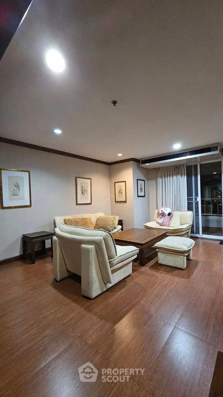 Spacious living room with cozy seating and elegant decor