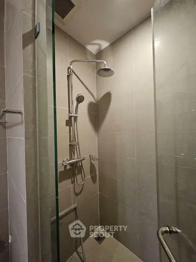 Modern bathroom shower with sleek design and glass enclosure in contemporary home.