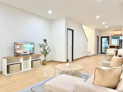 Spacious modern living room with elegant decor and open layout, perfect for relaxation and entertainment.