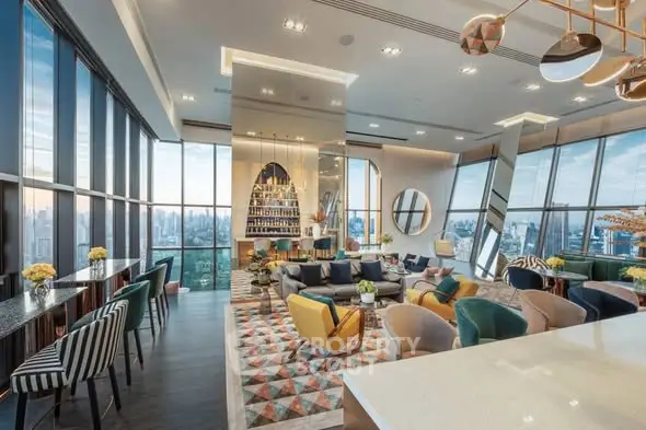 Luxurious high-rise living room with panoramic city views and modern decor.