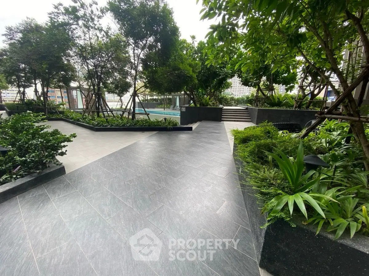 Luxurious garden area with lush greenery and modern design tiles